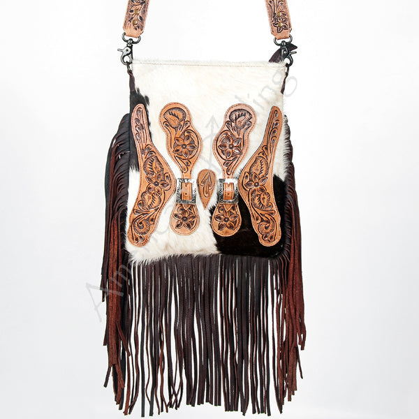 ADBG393 White & Black Cowhide Crossbody Bag with Tooled Leather Saddle Flap Accents and Fringe