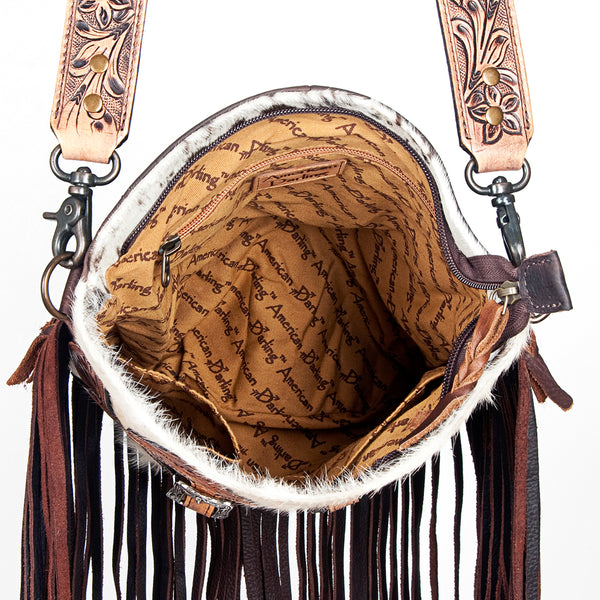 ADBG393 White & Black Cowhide Crossbody Bag with Tooled Leather Saddle Flap Accents and Fringe