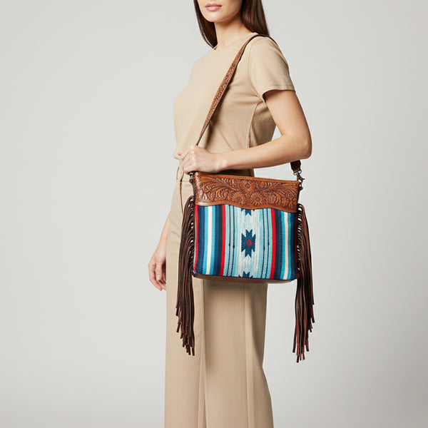 LC-ADBGZ557A Southwestern Woven & Tooled Leather Fringe Crossbody Bag - Blue Serape with Floral Tooled Strap
